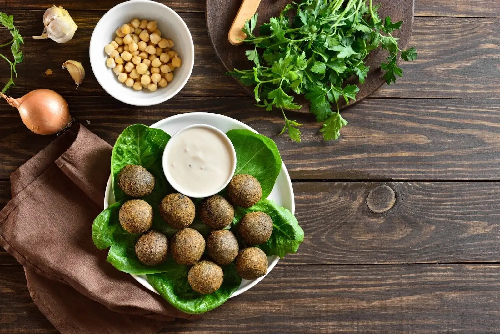 Delicious falafel on plate with fresh lettuce