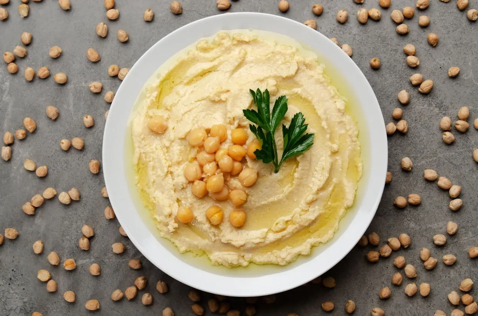 Traditional hummus, a popular chickpea-based dish at Aladdin Mediterranean Cuisine in Houston