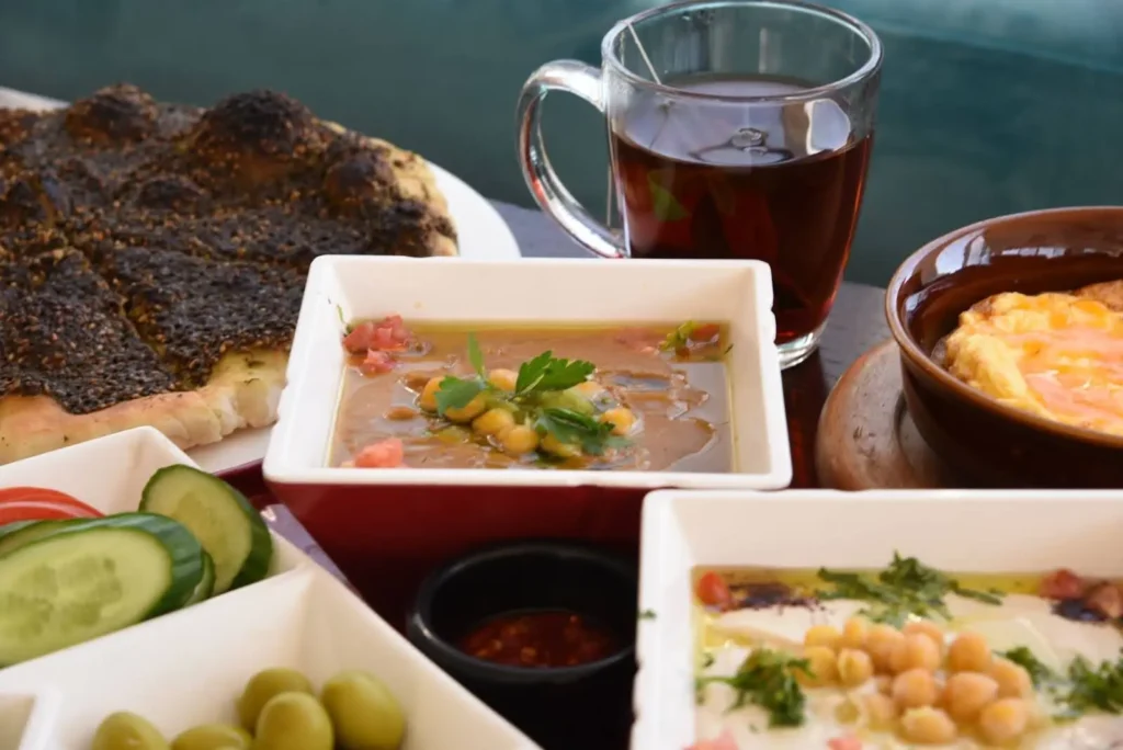 Lebanese lentil soup cultural feast with olives, bread, etc