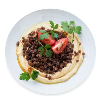 Mediterranean pureed chickpea dip with spicy beef topping.