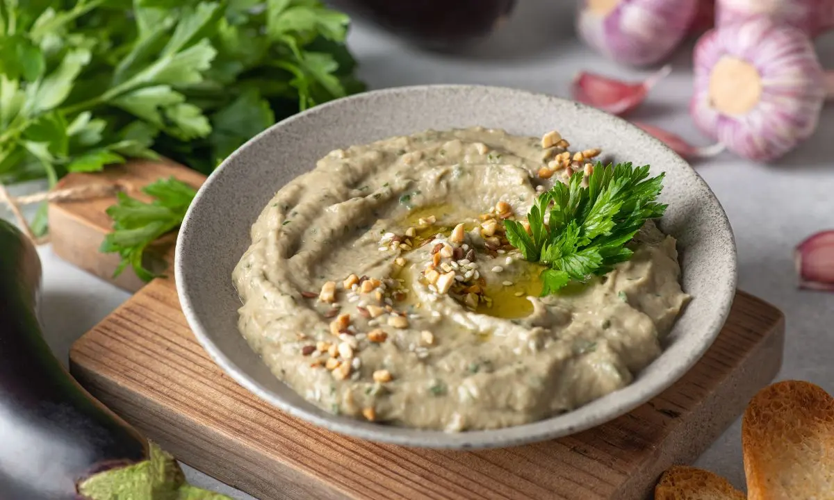 Baba ganoush garnished with parsley and olive oil