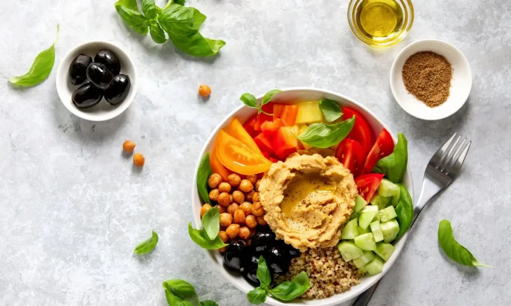 Mediterranean diet Buddha bowl with hummus served in a bowl