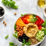 Mediterranean diet Buddha bowl with hummus served in a bowl