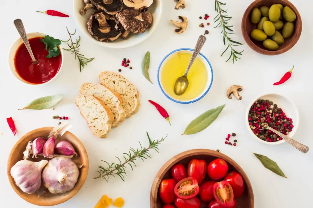 Mediterranean diet foods and ingredients placed on a white table