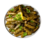 Stuffed grape leaves served with lemon and parsley at Aladdin Mediterranean Cuisine in Houston.