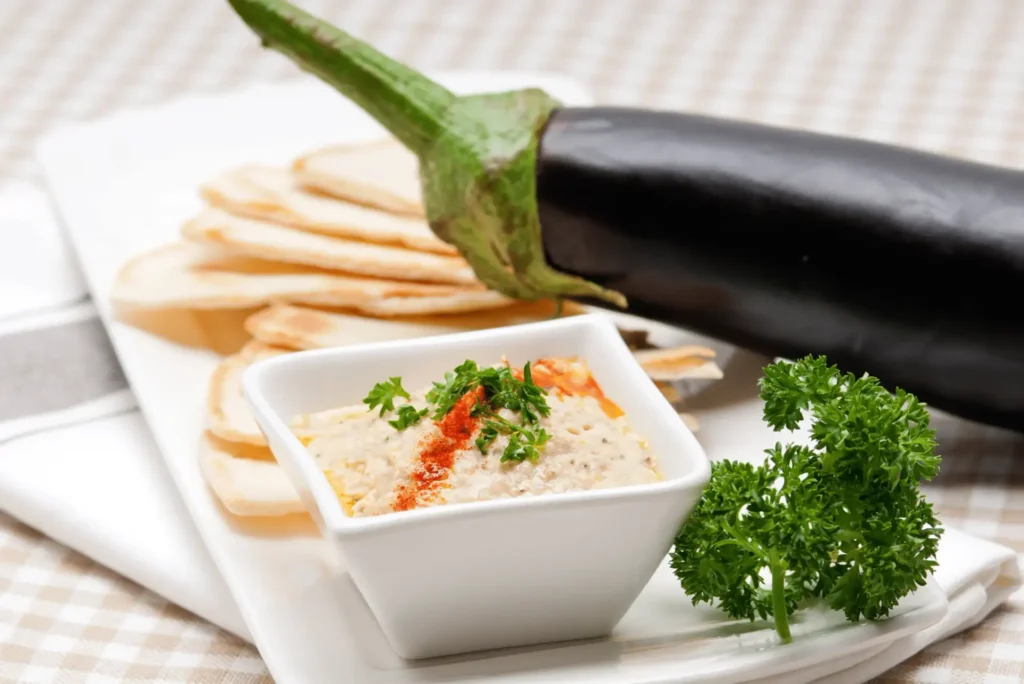 Smoky Baba Ganoush served with pita bread and olives