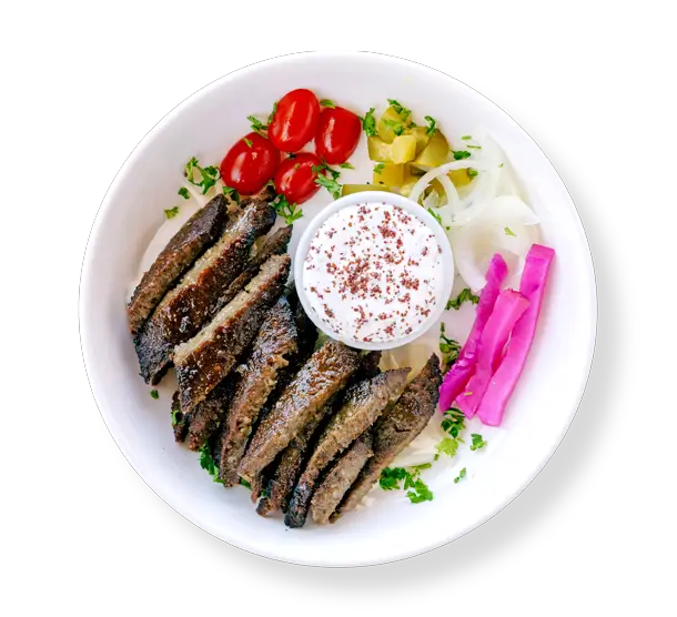 Lamb Gyro -cooked lamb gyro strips roasted on a vertical rotisserie, plated (no wrap) with rice and salad at Aladdin Mediterranean cuisine