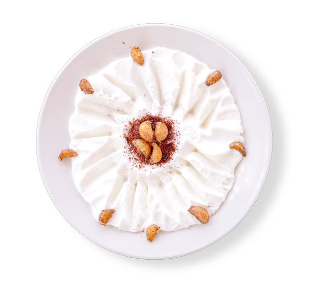 Creamy garlic dip (Toum) served with roasted garlic and sumac – Aladdin Mediterranean Cuisine Houston.