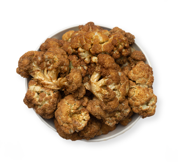 Golden roasted cauliflower florets seasoned with Mediterranean spices at Aladdin Mediterranean Cuisine Houston.