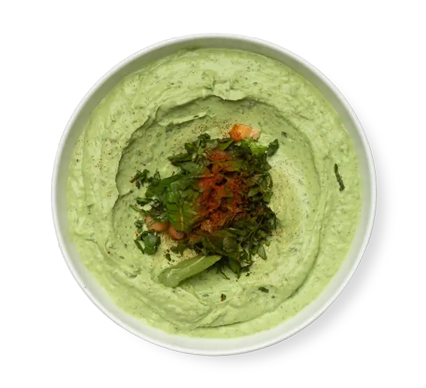 Spinach hummus topped with herbs and paprika from Aladdin Montrose in Houston.